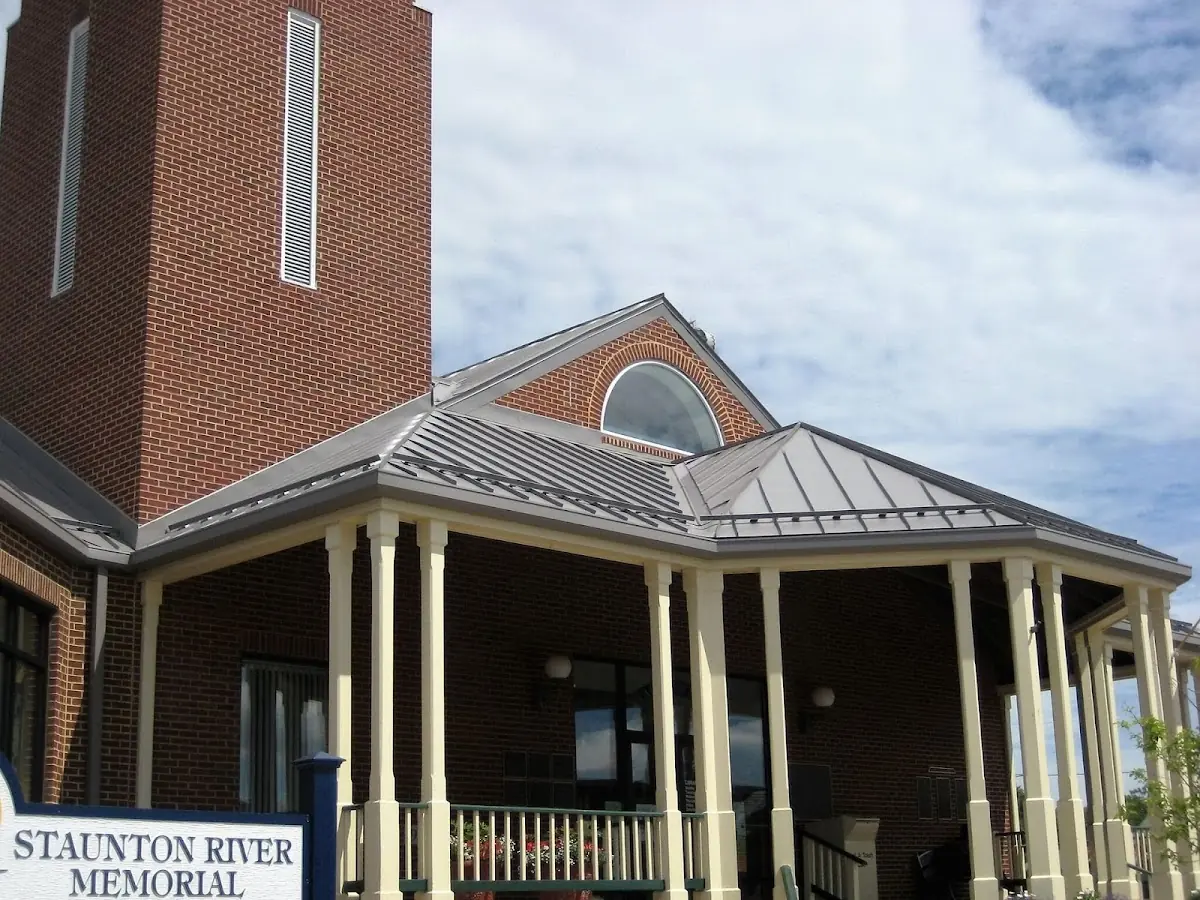 Skilled roofing craftsmen working on a residential roof in Klinesville